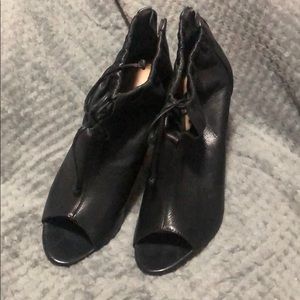 Black peep toe booties with strings
